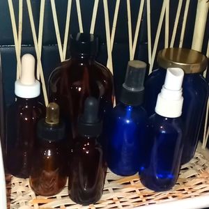 SET OF DARK GLASS BOTTLES